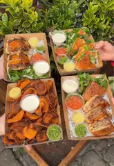 A fast-paced promotional video for Zala Grill in Camden Market, showcasing their Middle Eastern pita wraps, including lamb, chicken, pulled beef, and falafel options, alongside various sauces and sides.