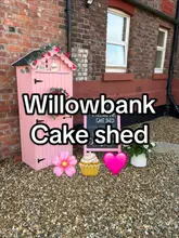 A short, handheld tour of the Willowbank Cake Shed in the Wirral, showcasing the variety of baked goods available, including brownies, cookies, and cupcakes. The video explains the self-service honesty box system, payment methods (cash, card, QR code), and operating hours, providing a clear and inviting look at this local business.