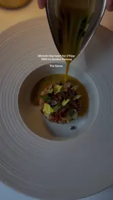 A short, elegant montage showcasing a Michelin-starred lunch at Restaurant 1890 by Gordon Ramsay, located within The Savoy. The video features shots of the venue exterior, professional service, and close-ups of refined, artistic plating.