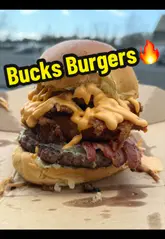 A casual, handheld food review video featuring a creator evaluating a 'Full Whack' burger from Bucks Burgers. The video focuses on the quality of the ingredients and the value for money, with the creator eating the burger inside a car.
