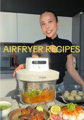 A high-quality recipe tutorial demonstrating a 3-course lunch prepared using a Ninja air fryer. The video features clear, well-lit shots of the cooking process, including Vietnamese chicken wings, tomato and miso baked cod, and simple 3-ingredient doughnuts.