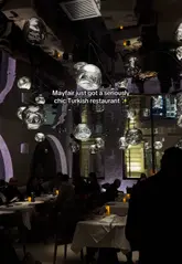 A polished, visually appealing reel showcasing a new Turkish restaurant in Mayfair. The video features high-quality, cinematic shots of the restaurant's interior and a variety of dishes, including mezze, lamb manti, and baklava, set to music with text overlays describing the experience.