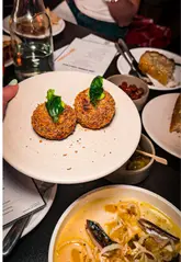 A creator visits House of Koko in Leeds to review their new evening menu, showcasing various dishes and the overall atmosphere.
