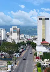 A travel guide video showcasing Kingston, Jamaica, featuring various hotels, restaurants, festivals, and landmarks, encouraging viewers to visit the capital city to experience the real Jamaica.