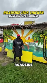 A review of a roadside Caribbean street food stall called Hot Grubz in London, featuring jerk chicken, curry goat, and homemade fruit punch.