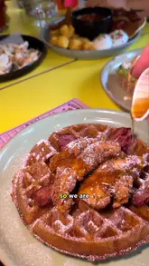 A review of the new brunch menu at Yard & Coop, featuring buttermilk fried chicken and waffles, pancakes with candy floss, an American breakfast, and avocado toast. The creator is joined by a young child.