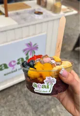 A creator visits the newly opened Açai Social Club in Leeds' Victoria Quarter, showcasing the process of building a custom açai bowl with various toppings.