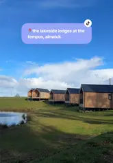 A couple's vlog-style review of an overnight stay at The Tempus, showcasing the lakeside lodge, outdoor spa bath, the tipi bar reopening, pizza, a flower arranging class, and a breakfast buffet.