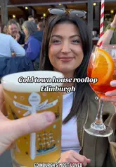 A creator visits Cold Town House in Edinburgh, highlighting the rooftop bar's reopening for the summer. The video features shots of the venue's atmosphere, views of Edinburgh Castle, and a variety of food and drink options, including pizza, meatballs, mini burgers, beer, and spritz cocktails.