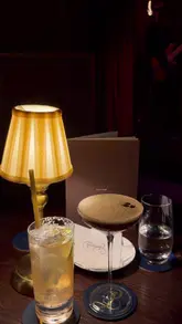 A short, atmospheric montage showcasing the interior, live jazz band, and cocktail offerings at Esmeralda's in Mayfair. The video focuses on the moody, upscale ambiance suitable for a night out.