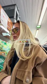 A vlog-style tour of L7 Village Market in Liverpool, highlighting the wide range of international products, including fresh produce, bakery items, deli meats, and frozen goods.