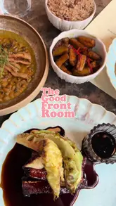 A review of The Good Front Room in Dalston, highlighting the Caribbean cuisine, the vibrant interior, and the chef's personal touch. The video features a variety of dishes including pork belly, short rib, and mac and cheese, emphasizing the sharing-plate concept.
