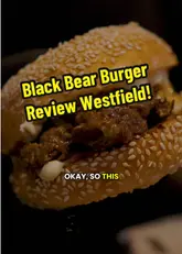 A first-person food review of Black Bear Burger at Westfield, featuring a variety of starters and a main burger. The creator provides honest feedback on the quality and flavor of the dishes, specifically highlighting the starters while offering constructive criticism on the burger's bun-to-meat ratio.