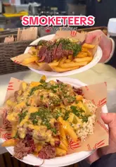 A short, punchy video showcasing the food preparation at Smoketeers in Camden Market. The video features close-up shots of slow-cooked brisket, loaded fries with cheese sauce, and burgers, accompanied by a voiceover describing the food.