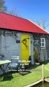 The video is a walkthrough tour of 'The Nest,' an Airbnb cottage located near Carrickmacross in County Monaghan, Ireland. It showcases the exterior, including a small pond and garden, and the interior, highlighting the cozy bedroom, fireplace, and kitchen area. The video aims to promote the cottage as a peaceful and relaxing getaway destination.