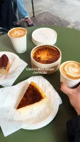 A short, punchy video showcasing the Basque cheesecakes at La Maritxu, featuring close-ups of the classic and manchego flavors being sliced and served alongside coffee.