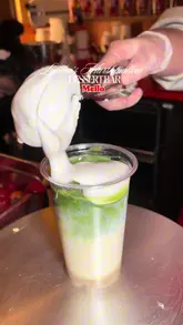 A short, punchy video showcasing the menu at Mello, a marshmallow dessert bar located in Seven Dials Market. The video features close-up shots of iced matcha drinks topped with whipped marshmallow crème and fresh strawberries, highlighting the preparation process and the final product.