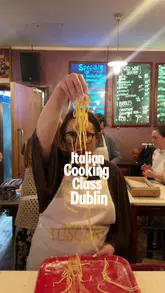 A promotional vlog showcasing an Italian cooking class experience in Dublin, featuring pasta and pizza making, tied to a movie promotion.