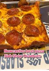 A fast-paced promotional video showcasing Detroit-style pizza slabs at a venue called Slab Shop located within Lockup in Newcastle. The video features close-ups of various pizza toppings, cheese pulls, and the venue's interior and terrace.