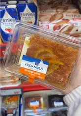 A quick-cut video showcasing a variety of Greek-style food products available at a Lidl supermarket, including cakes, pastries, snacks, and pantry items.