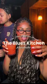 A group of friends enjoys a 'Slow Jams' bottomless brunch at The Blues Kitchen in Manchester, featuring unlimited drinks, music, and a lively social atmosphere.