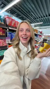 A creator walks through an M&S food hall, highlighting various sweet treats, breakfast items, and snacks, providing a quick review of each product's appeal.