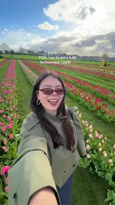 A short, upbeat video showcasing a visit to a tulip festival near Leeds. The creator walks through the fields, shows the scenery, a vintage truck, a ferris wheel, and food options like ice cream and milkshakes.