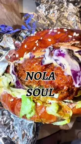 A video featuring the owner of Nola Soul in Glasgow, introducing the venue and showcasing the preparation of their fried chicken burgers and shrimp po' boy subs. The creator highlights their commitment to making everything from scratch, including the buns.