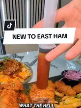 A fast-paced, energetic food review of Chickaros in East Ham, featuring the creator trying various dishes including Nashville-style broasted chicken with a sauce injection, lamb chops, and a gourmet burger. The video uses close-up shots to highlight the food's texture and presentation, maintaining high engagement throughout.