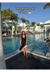 A couple's day-in-the-life vlog documenting their stay at a hotel in Lanzarote, featuring breakfast, pool time, a walk to the beach, and evening drinks.