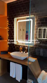 A short, montage-style video showcasing the interior design and atmosphere of the 25hours Hotel in Zurich, featuring shots of the bedroom, bathroom, and lounge area.