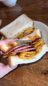 A review of a brunch spot called Hometown in East Belfast, featuring retro-inspired dishes like bacon frazzle buttys, potato smiley faces, and cereal milk yogurt.