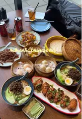 A review of a Chinese restaurant in London, featuring various Sichuan-style dishes like Dan Dan noodles, dumplings, and aromatic crispy duck.
