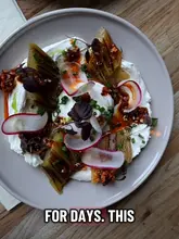 A festive table of beautifully presented dishes and drinks at a highly-rated Brighton restaurant, celebrating a birthday.