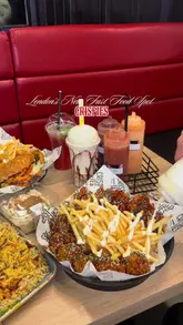 A fast-paced montage showcasing various fast food items from Crispies, including wings, burgers, fries, milkshakes, and milk cake. The video highlights the variety of the menu and the casual dining environment.