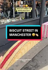 A short, energetic vlog-style video showcasing a street in Manchester where public benches have been painted to resemble iconic British biscuits, including Bourbons, Custard Creams, Pink Wafers, and Jammy Dodgers.
