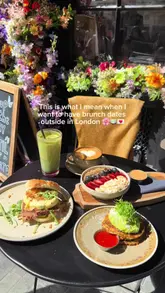 A short, aesthetic reel showcasing a brunch visit to TomTom Coffee House in London. The video highlights the cafe's outdoor terrace, various brunch dishes including a beef pastrami sandwich and a fruit bowl, and drinks like matcha and coffee.