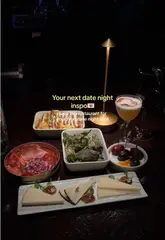 A short, atmospheric montage showcasing a 'dark brunch' experience at Aqua Nueva, featuring cocktails, Spanish sharing plates, and a rooftop DJ party.
