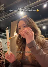 A vlog-style video documenting a candle decorating workshop hosted by a social club in London. The creators show the process of decorating candles with dried flowers and highlight the social aspect of meeting new people in a relaxed setting.