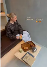 A short, aesthetic montage showcasing the interior and pastry selection of a new gluten-free bakery in Islington, London. The video features close-ups of various baked goods, coffee, and the creator enjoying the space.