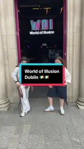 A short, energetic video featuring two people exploring the World of Illusion in Dublin, posing in various interactive rooms designed for optical illusions.