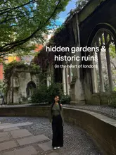 A high-quality, well-composed photograph of a person standing in the historic ruins of St Dunstan in the East Church Garden in London, featuring text overlay that identifies the location.