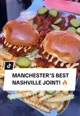 A delicious plate of Flo's Nashville hot chicken meal, crispy and golden-brown, served at their Withington, Manchester restaurant.