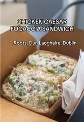 A short review of a cafe located inside a library in Dun Laoghaire, focusing on their popular chicken Caesar focaccia sandwich.