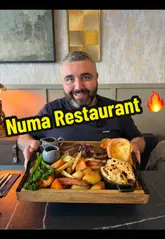 A detailed review of a Sunday roast sharing board and various starters at Numa Restaurant in Portadown. The creators walk through the menu, showcase the venue's interior, and provide tasting notes on the food, drinks, and desserts.