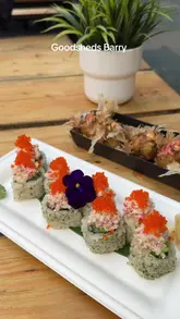 A montage-style reel showcasing various food and drink offerings at Goodsheds in Barry, including sushi, loaded fries, fried chicken, and cocktails, followed by a brief shot of the venue's exterior.