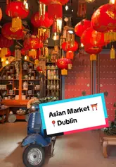 A first-person vlog tour of an Asian supermarket in Dublin, highlighting the extensive range of products available in the aisles and the outdoor 'eat yard' food court area. The creator walks through the store, pointing out specific items like noodles and sauces, and samples a drink and snack outside.