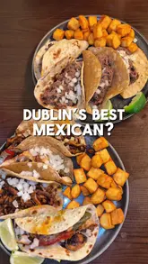 A food review video featuring a visit to Pickosito in Dublin. The creator showcases the menu, the exterior of the venue, and close-up shots of nachos and various tacos, providing a brief commentary on the quality of the food.