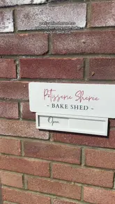 A creator visits a small, independent 'bake shed' in Bedford, showcasing the variety of brownies, cookies, and cakes available, including vegan and gluten-free options. The video concludes with the creator trying a brownie in her car.