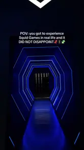 A promotional video for a Squid Game-themed VR experience at Sandbox VR in Birmingham. The video features the group putting on VR gear, interacting with a robotic cocktail maker, and playing the game, providing a clear overview of the activity and the venue's atmosphere.